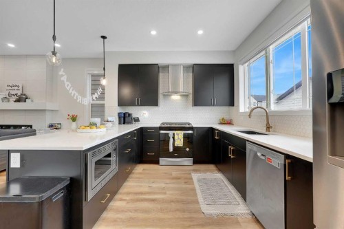 84 Magnolia Common Se, Calgary, AB - Indoor Photo Showing Kitchen With Upgraded Kitchen
