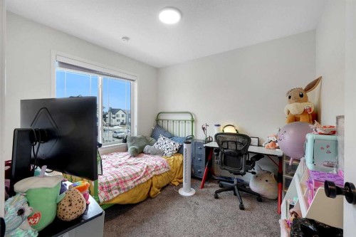 84 Magnolia Common Se, Calgary, AB - Indoor Photo Showing Bedroom