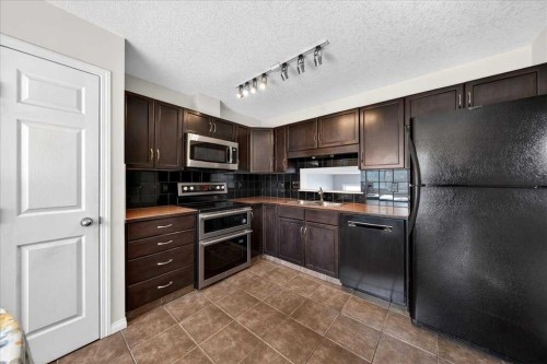 99 Copperfield Court Se, Calgary, AB - Indoor Photo Showing Kitchen