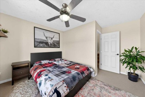 99 Copperfield Court Se, Calgary, AB - Indoor Photo Showing Bedroom