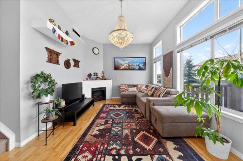 99 Copperfield Court Se, Calgary, AB - Indoor Photo Showing Living Room With Fireplace