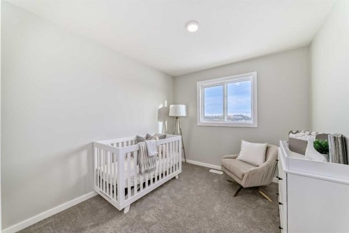 142 Sora Gardens Se, Calgary, AB - Indoor Photo Showing Bedroom