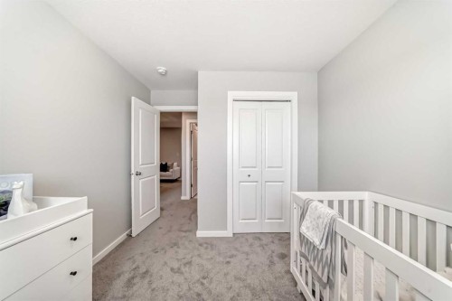 142 Sora Gardens Se, Calgary, AB - Indoor Photo Showing Bedroom