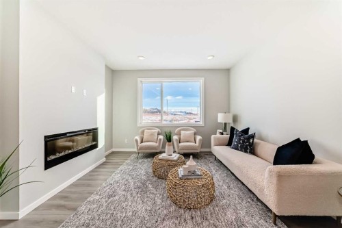 142 Sora Gardens Se, Calgary, AB - Indoor Photo Showing Living Room With Fireplace