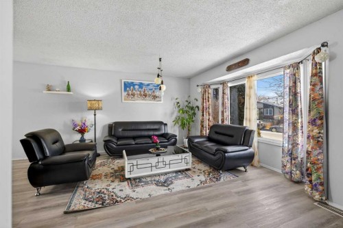 195 Fallswater Road Ne, Calgary, AB - Indoor Photo Showing Living Room
