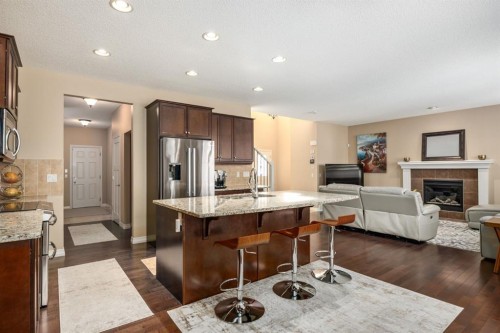 596 Everbrook Way Sw, Calgary, AB - Indoor Photo Showing Kitchen With Fireplace With Upgraded Kitchen