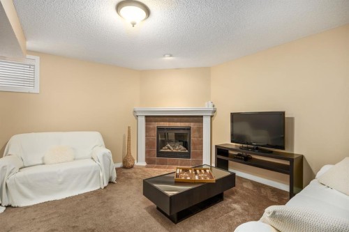596 Everbrook Way Sw, Calgary, AB - Indoor Photo Showing Living Room With Fireplace