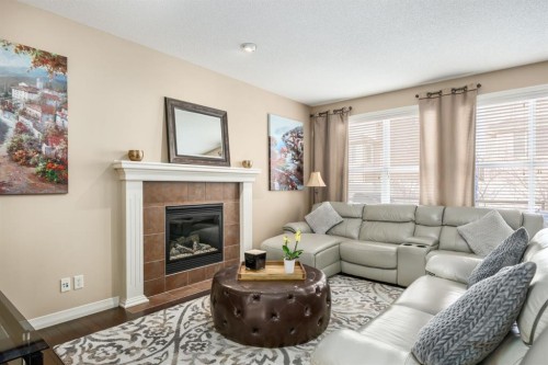 596 Everbrook Way Sw, Calgary, AB - Indoor Photo Showing Living Room With Fireplace