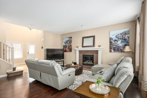 596 Everbrook Way Sw, Calgary, AB - Indoor Photo Showing Living Room With Fireplace