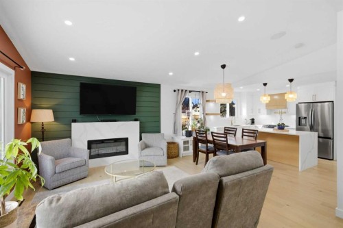 428 Queen Anne Way Se, Calgary, AB - Indoor Photo Showing Living Room With Fireplace