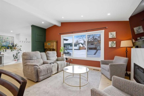 428 Queen Anne Way Se, Calgary, AB - Indoor Photo Showing Living Room With Fireplace