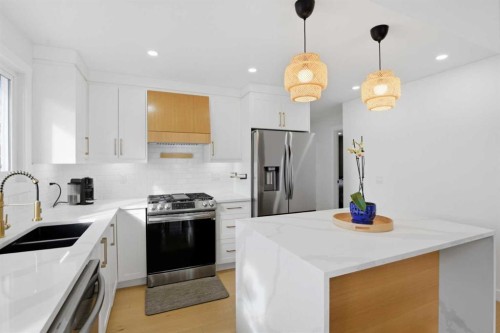 428 Queen Anne Way Se, Calgary, AB - Indoor Photo Showing Kitchen With Double Sink With Upgraded Kitchen