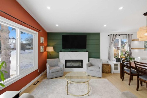 428 Queen Anne Way Se, Calgary, AB - Indoor Photo Showing Living Room With Fireplace