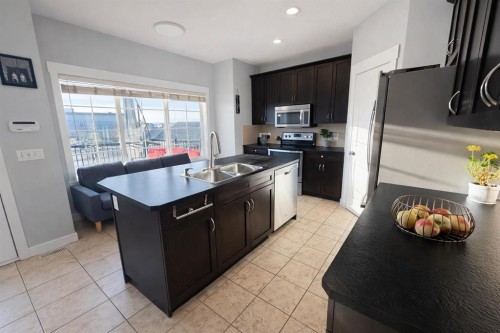 292 Rainbow Falls Drive, Chestermere, AB - Indoor Photo Showing Kitchen With Double Sink