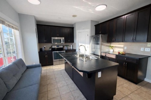 292 Rainbow Falls Drive, Chestermere, AB - Indoor Photo Showing Kitchen With Double Sink