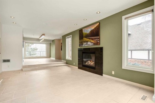 16 Stratton Place Sw, Calgary, AB - Indoor Photo Showing Other Room With Fireplace