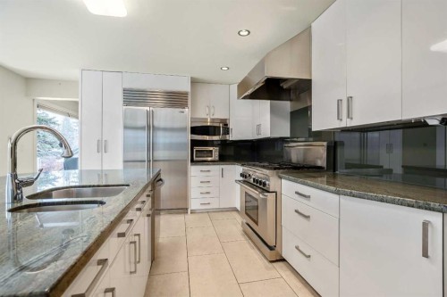 16 Stratton Place Sw, Calgary, AB - Indoor Photo Showing Kitchen With Stainless Steel Kitchen With Upgraded Kitchen