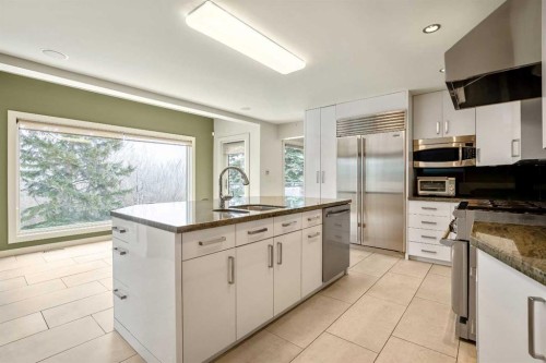 16 Stratton Place Sw, Calgary, AB - Indoor Photo Showing Kitchen With Stainless Steel Kitchen
