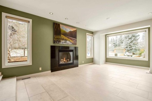 16 Stratton Place Sw, Calgary, AB - Indoor Photo Showing Living Room With Fireplace