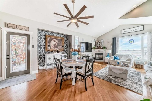 33 Boulder Creek Manor Se, Langdon, AB - Indoor With Fireplace