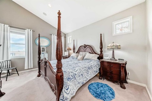 33 Boulder Creek Manor Se, Langdon, AB - Indoor Photo Showing Bedroom