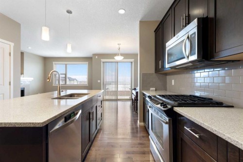 98 Nolanfield Road Nw, Calgary, AB - Indoor Photo Showing Kitchen With Double Sink With Upgraded Kitchen