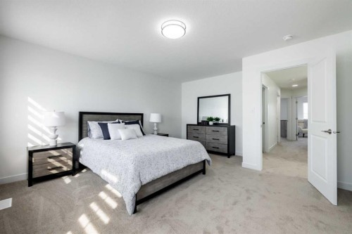44 Heritage Manor, Cochrane, AB - Indoor Photo Showing Bedroom
