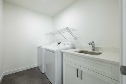 44 Heritage Manor, Cochrane, AB - Indoor Photo Showing Laundry Room