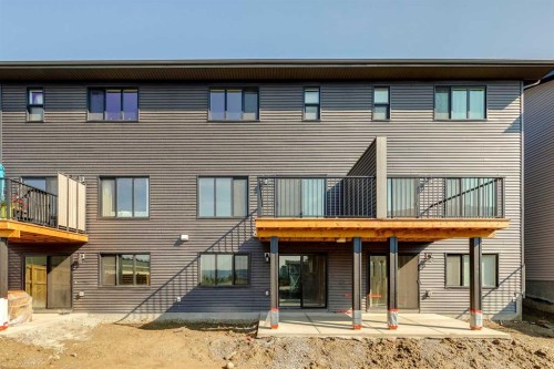 44 Heritage Manor, Cochrane, AB - Outdoor With Deck Patio Veranda With Exterior