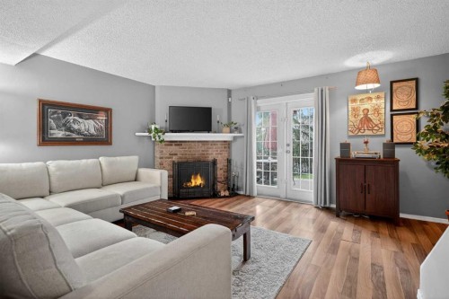 28-6503 Ranchview Drive Nw, Calgary, AB - Indoor Photo Showing Living Room With Fireplace