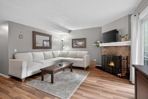 28-6503 Ranchview Drive Nw, Calgary, AB - Indoor Photo Showing Living Room With Fireplace