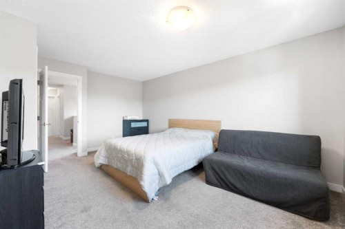 24 Seton Grove Se, Calgary, AB - Indoor Photo Showing Bedroom