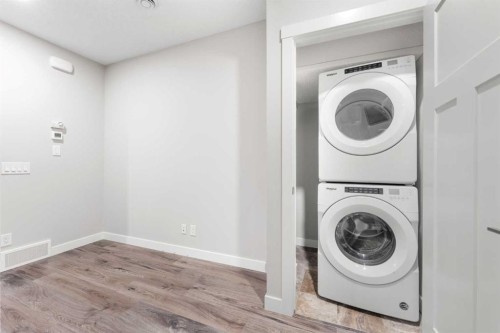 24 Seton Grove Se, Calgary, AB - Indoor Photo Showing Laundry Room