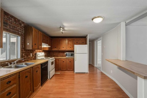 8 29415  Range Rd 52, Rural Mountain View County, AB - Indoor Photo Showing Kitchen With Double Sink