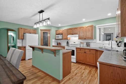 112 West Creek Close, Chestermere, AB - Indoor Photo Showing Kitchen With Double Sink