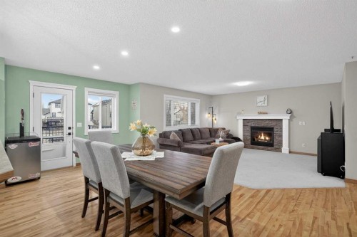 112 West Creek Close, Chestermere, AB - Indoor Photo Showing Dining Room With Fireplace