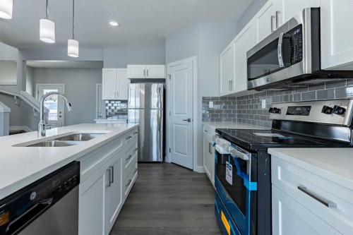 3 Heritage Point, Cochrane, AB - Indoor Photo Showing Kitchen With Double Sink With Upgraded Kitchen