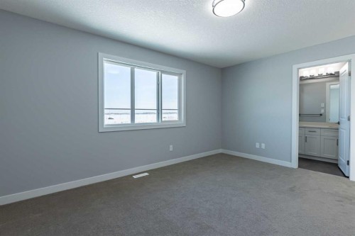 3 Heritage Point, Cochrane, AB - Indoor Photo Showing Other Room