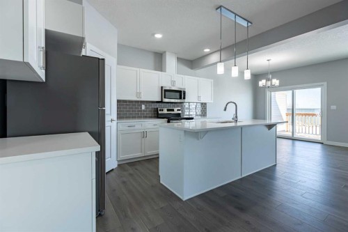 3 Heritage Point, Cochrane, AB - Indoor Photo Showing Kitchen With Upgraded Kitchen