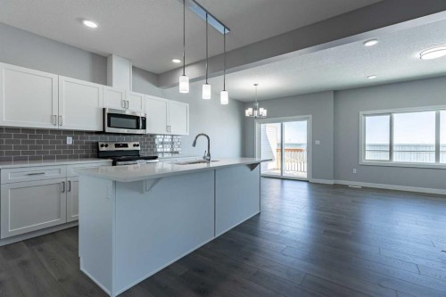 3 Heritage Point, Cochrane, AB - Indoor Photo Showing Kitchen With Upgraded Kitchen