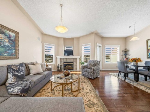 84 Sierra Morena Landing Sw, Calgary, AB - Indoor Photo Showing Living Room With Fireplace