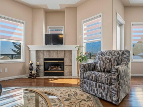 84 Sierra Morena Landing Sw, Calgary, AB - Indoor Photo Showing Living Room With Fireplace