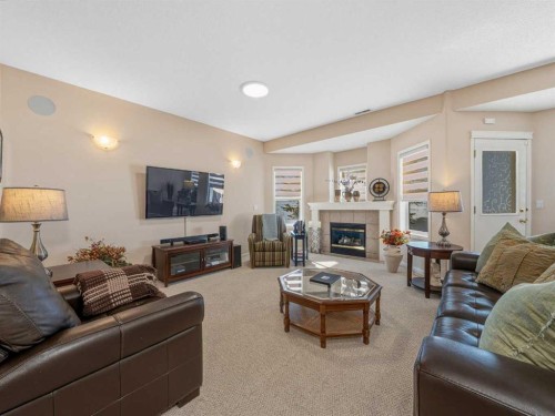 84 Sierra Morena Landing Sw, Calgary, AB - Indoor Photo Showing Living Room With Fireplace