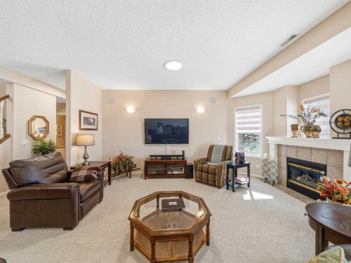 84 Sierra Morena Landing Sw, Calgary, AB - Indoor Photo Showing Living Room With Fireplace