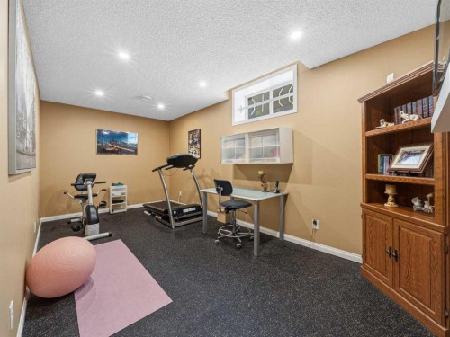 84 Sierra Morena Landing Sw, Calgary, AB - Indoor Photo Showing Gym Room