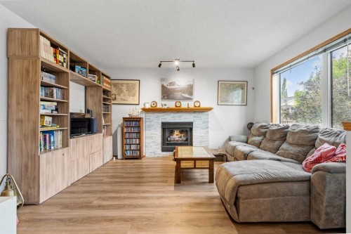 39 Arbour Wood Close Nw, Calgary, AB - Indoor Photo Showing Living Room With Fireplace