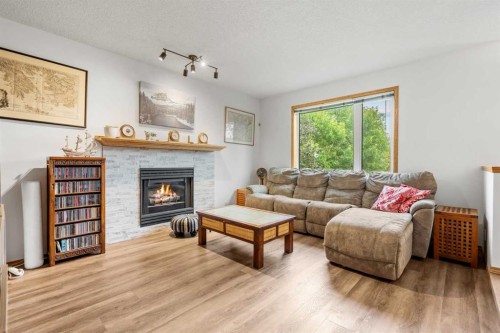 39 Arbour Wood Close Nw, Calgary, AB - Indoor Photo Showing Living Room With Fireplace