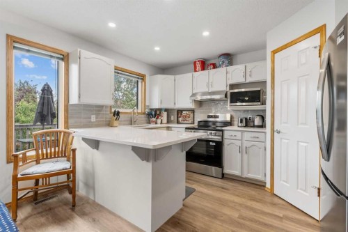 39 Arbour Wood Close Nw, Calgary, AB - Indoor Photo Showing Kitchen With Stainless Steel Kitchen With Upgraded Kitchen