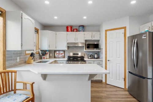 39 Arbour Wood Close Nw, Calgary, AB - Indoor Photo Showing Kitchen With Stainless Steel Kitchen With Upgraded Kitchen