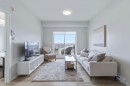 1411-220 Seton Grove Se, Calgary, AB  - Indoor Photo Showing Living Room 